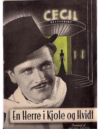 EN HERRE I KJOLE OG HVIDT