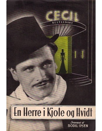 EN HERRE I KJOLE OG HVIDT